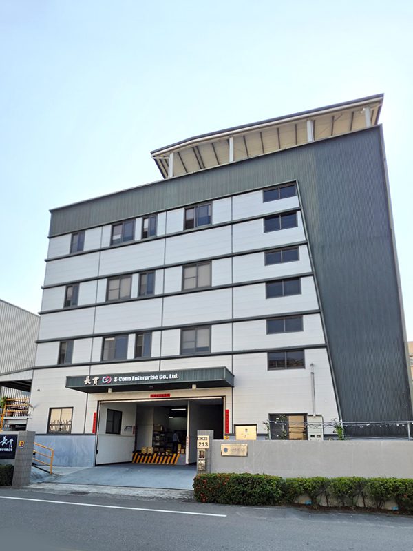 Exterior view of the S-Conn Enterprise Co., Ltd. headquarters building, a modern 5-story industrial facility featuring a white and grey facade under a clear blue sky.